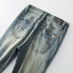 Amr Ripped Patch Jeans